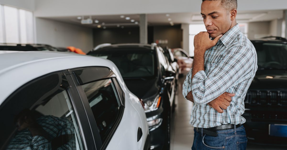 Man analysing car to buy